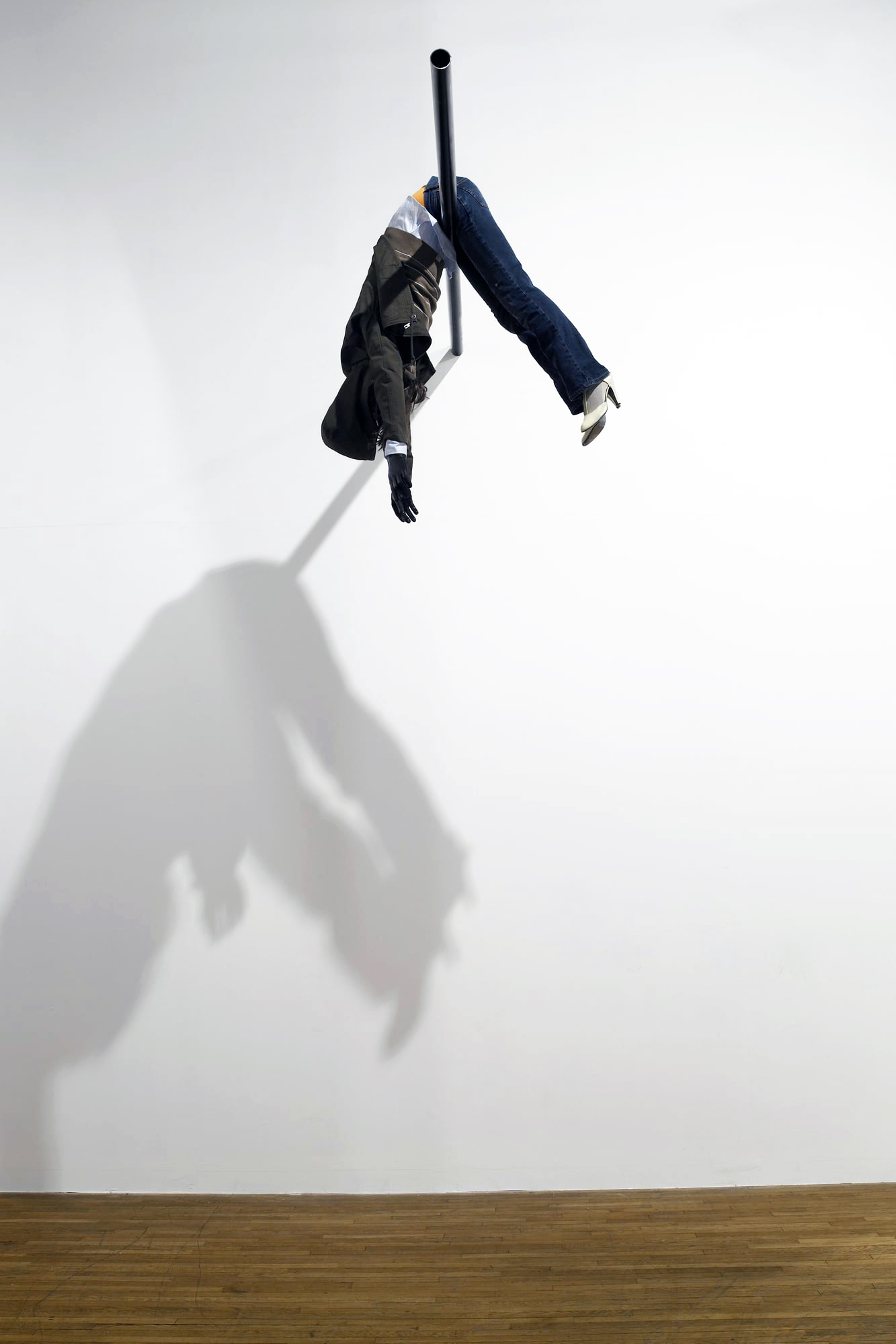 suspended sculpture of a women, hyper realistic sculpture